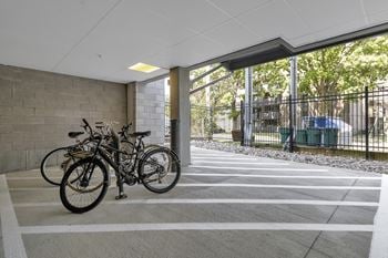 A group of bikes parked in a parking garage
